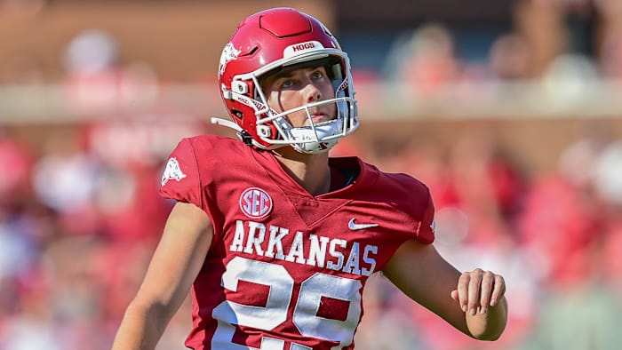 Razorbacks Cam Little after a kick against Cincinnati